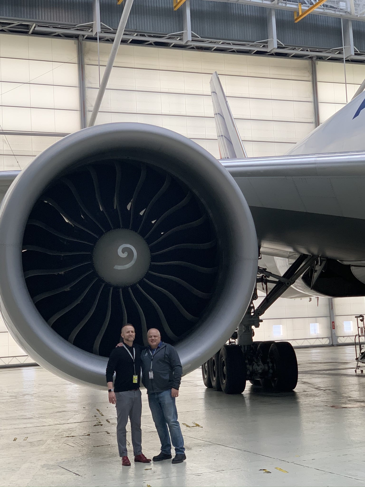 Team in front of Boeing 777 GE90 Engine